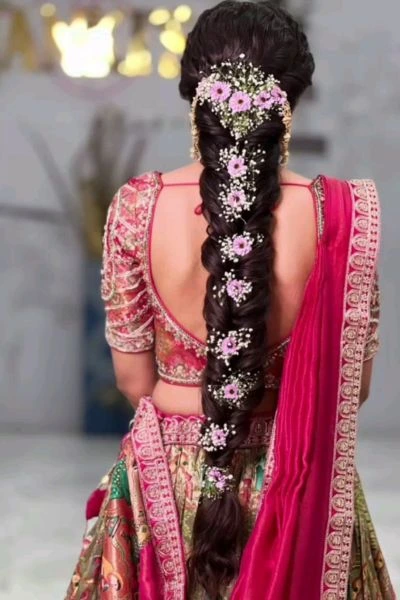 long braid bridal hairstyle with flowers